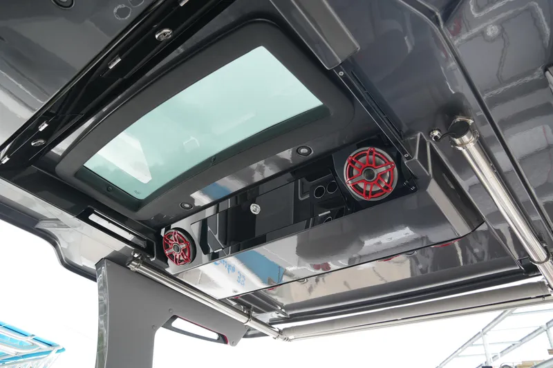 Slide: The Image of Luxurious seating in 2025 Fountain 38 SCX boat, featuring gray and red upholstery. - 26