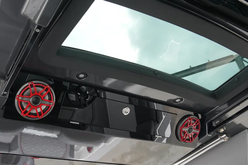 Slide: The Image of 2025 Fountain 38 SCX boat interior with red speakers and skylight. - 33