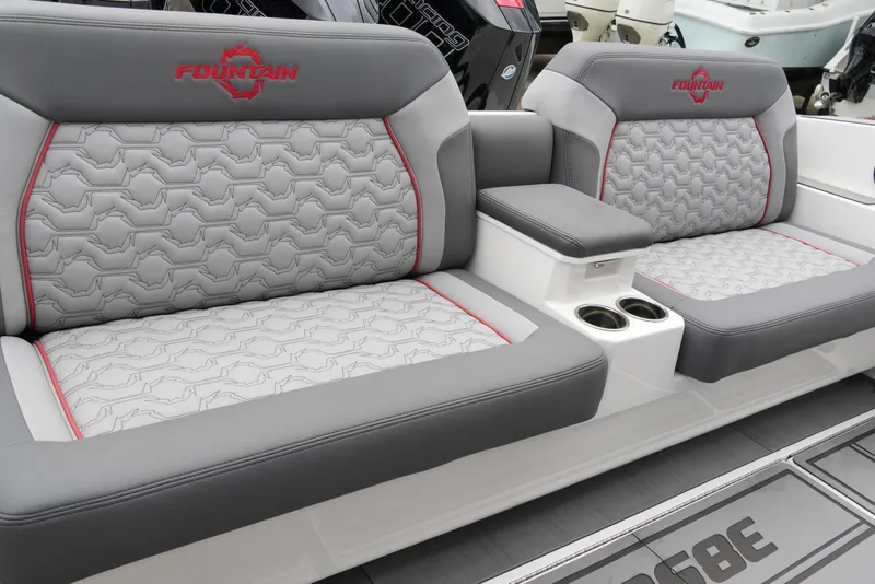 Slide: The Image of 2025 Fountain 38 SCX boat seats with gray upholstery and red accents. - 34