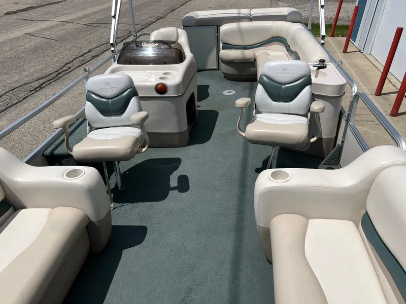 Slide: The Image of 2006 Sun Tracker PB 24 pontoon boat interior with seating and console. - 10