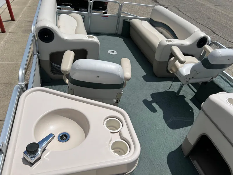 Slide: The Image of 2006 Sun Tracker PB 24 pontoon boat interior with seating and sink. - 12
