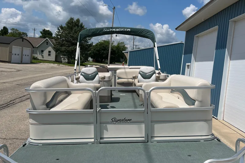 Slide: The Image of 2006 Sun Tracker PB 24 pontoon boat with canopy and spacious seating. - 24