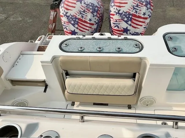 Slide: The Image of 2018 Sea Fox 288 Commander boat interior with American flag-themed seat covers. - 21