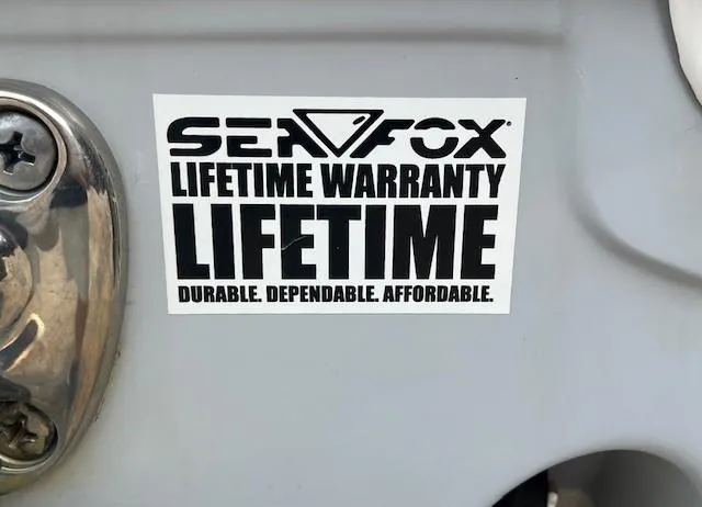 Slide: The Image of Sea Fox 288 Commander 2018 with lifetime warranty sticker, emphasizing durability and affordability. - 24