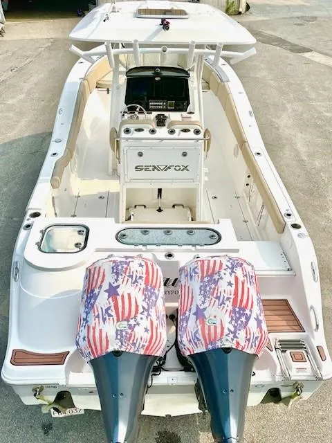 Slide: The Image of 2018 Sea Fox 288 Commander boat with twin engines and patriotic covers. - 6