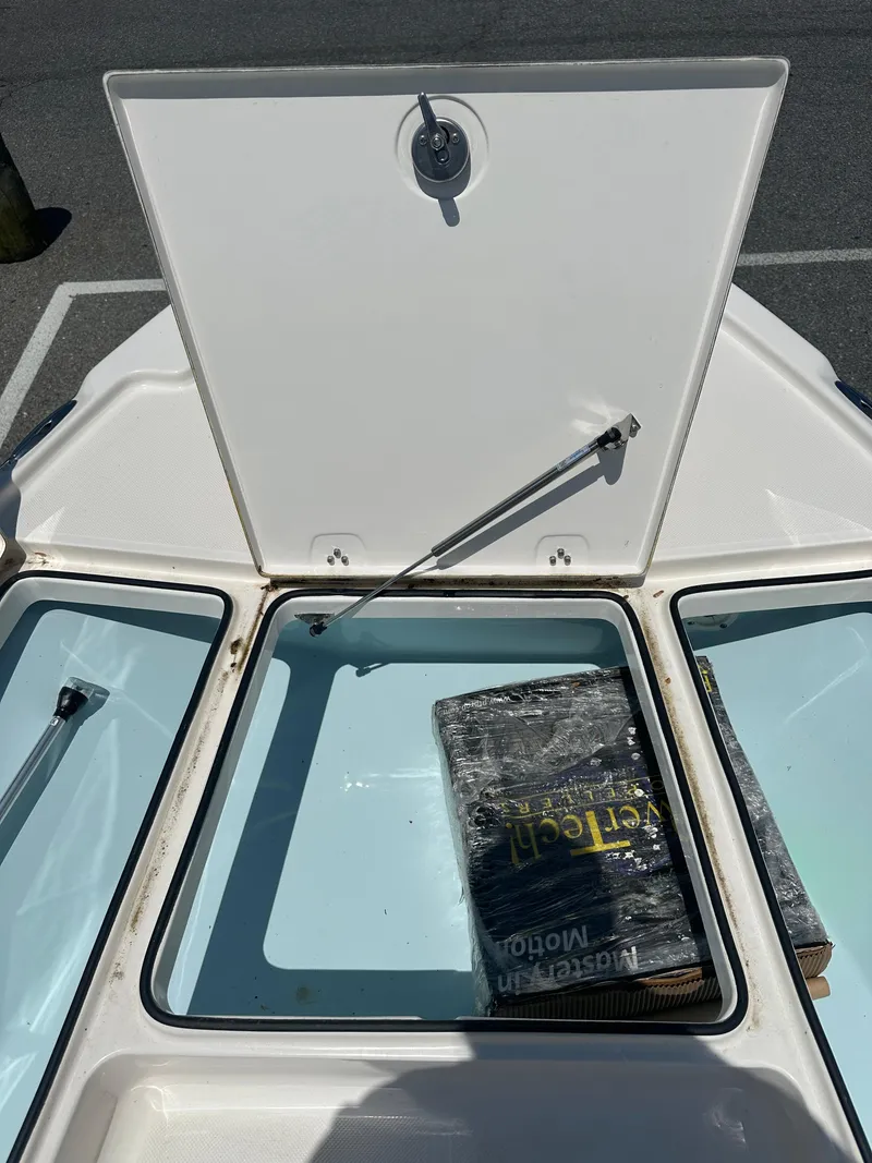 Slide: The Image of 2024 Sea Born FX21 Bay LT storage compartment with open hatch. - 10
