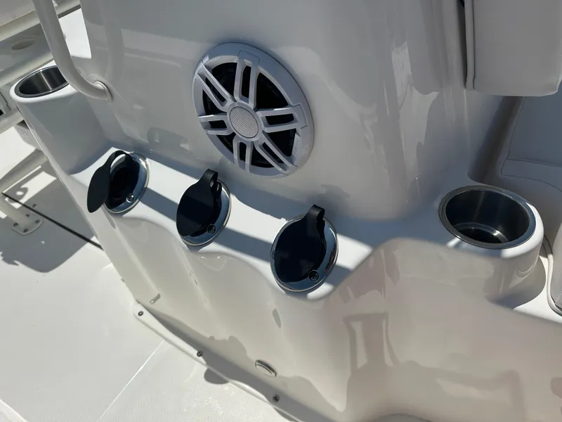 Slide: The Image of 2024 Sea Born FX21 Bay LT boat console with cup holders and speaker. - 16