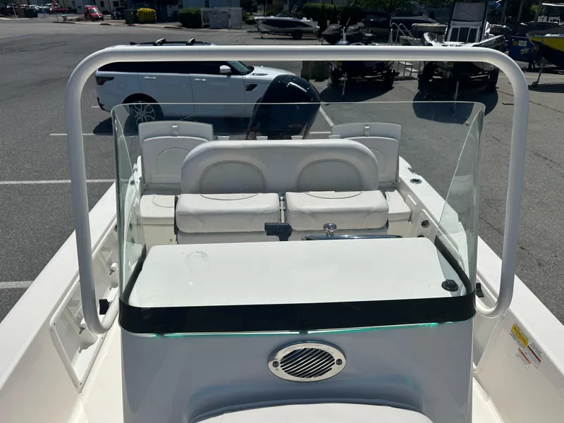 Slide: The Image of 2024 Sea Born FX21 Bay LT boat interior with seating and console. - 17