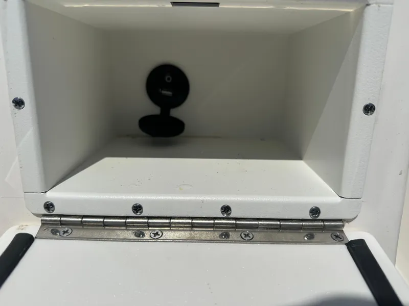 Slide: The Image of 2024 Sea Born FX21 Bay LT storage compartment with hinge and latch. - 22