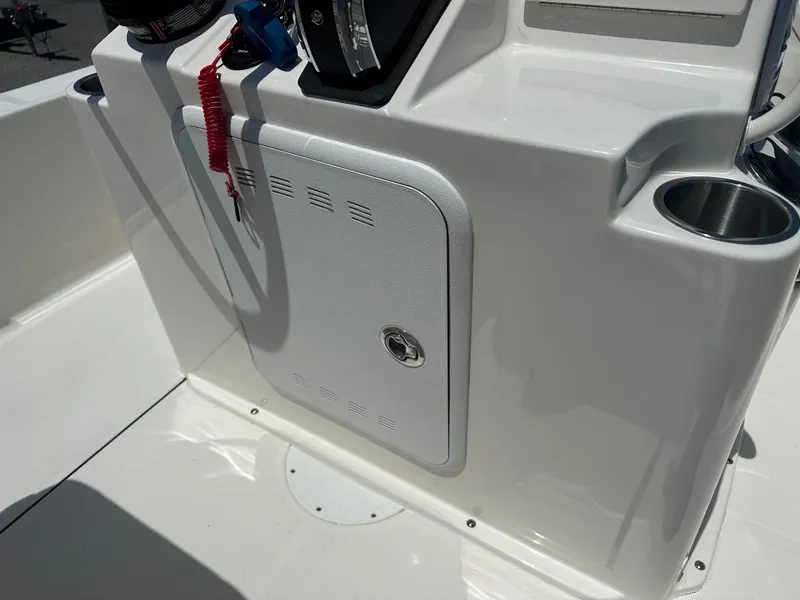 Slide: The Image of 2024 Sea Born FX21 Bay LT boat console with storage compartment and cup holder. - 23