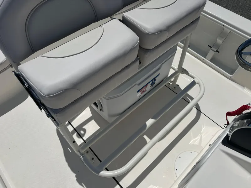 Slide: The Image of 2024 Sea Born FX21 Bay LT boat seating and storage area. - 26