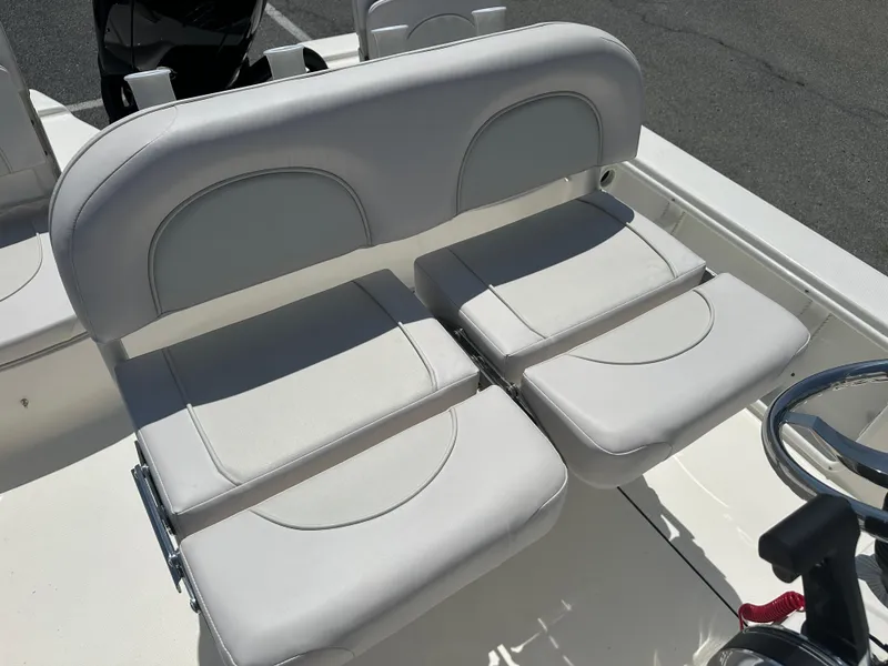 Slide: The Image of 2024 Sea Born FX21 Bay LT boat with cushioned seating. - 27