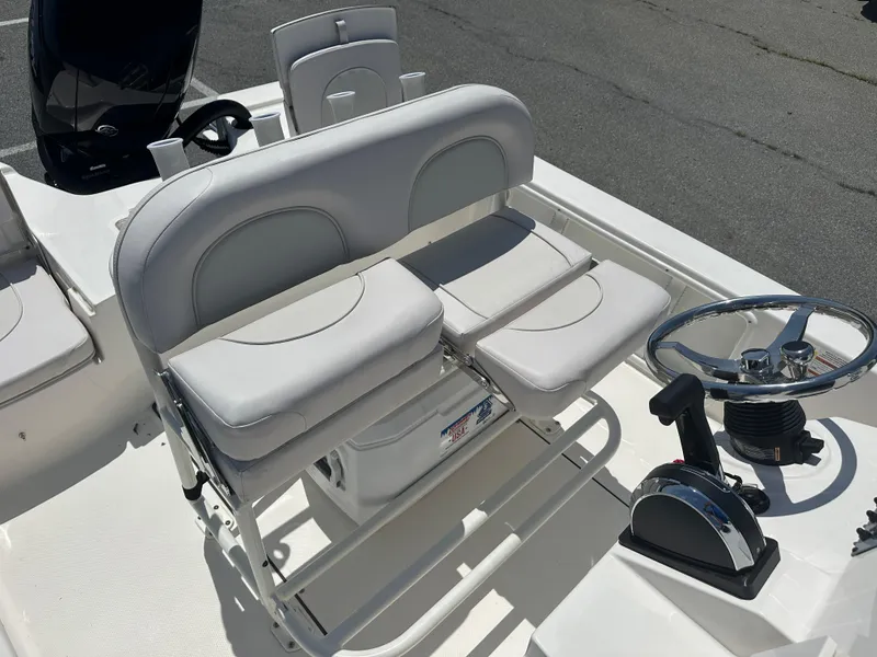 Slide: The Image of 2024 Sea Born FX21 Bay LT boat interior with dual seats and steering console. - 28