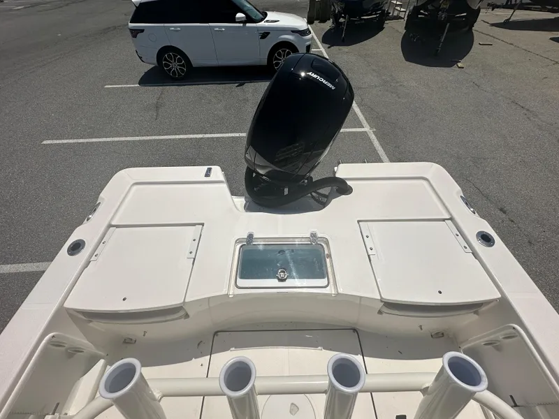 Slide: The Image of 2024 Sea Born FX21 Bay LT boat with outboard motor in parking lot. - 29
