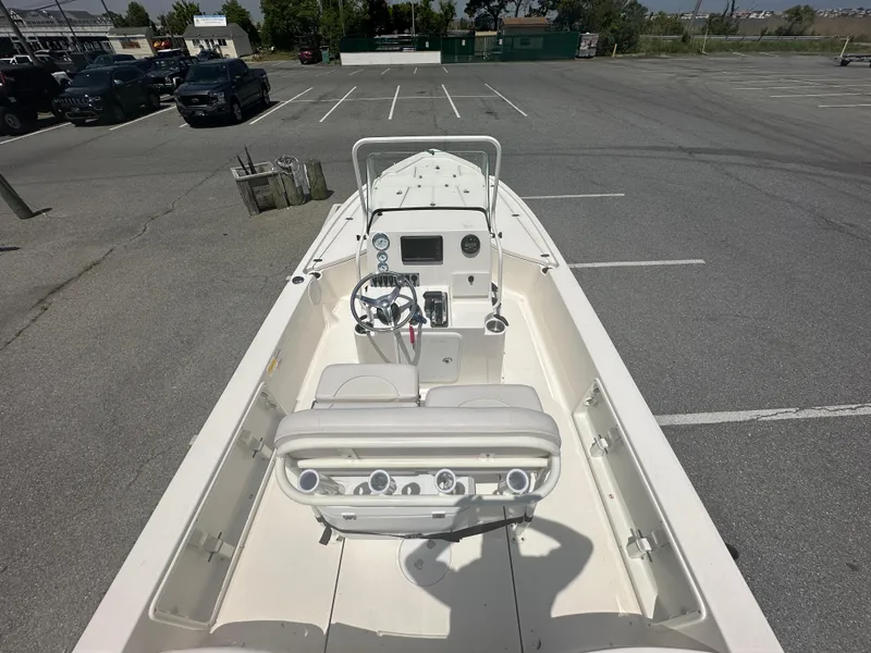 Slide: The Image of 2024 Sea Born FX21 Bay LT boat in a parking lot, view of the helm and seating. - 31