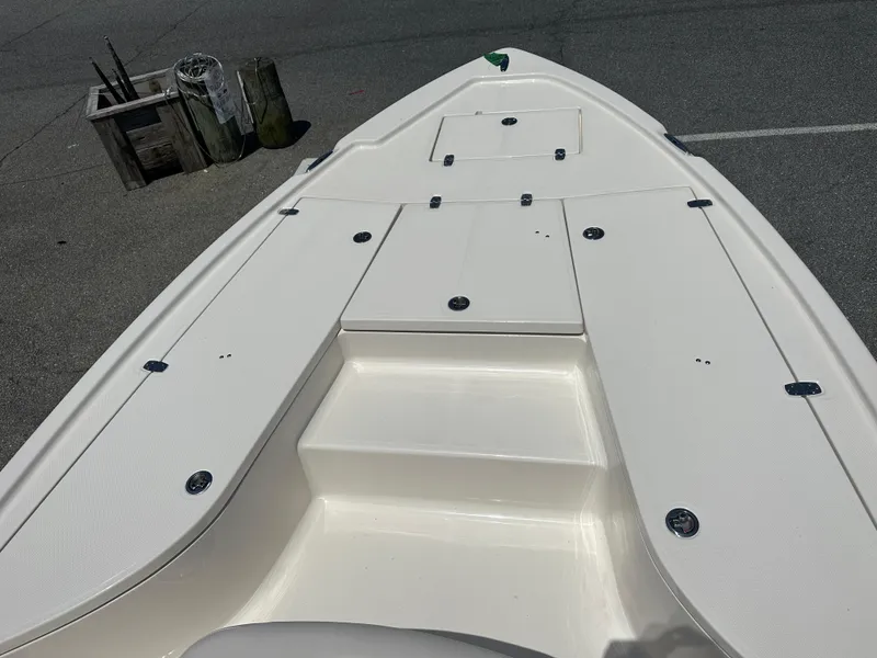 Slide: The Image of 2024 Sea Born FX21 Bay LT boat deck with storage compartments. - 6