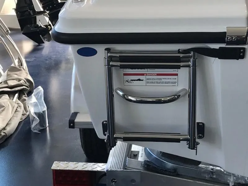 Slide: The Image of 2025 Edgewater 158 CS boat with rear ladder and safety warning label. - 13