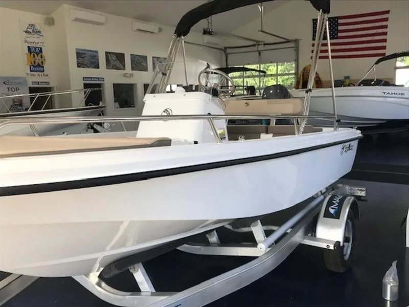 Slide: The Image of 2025 Edgewater 158 CS boat on trailer in showroom. - 4