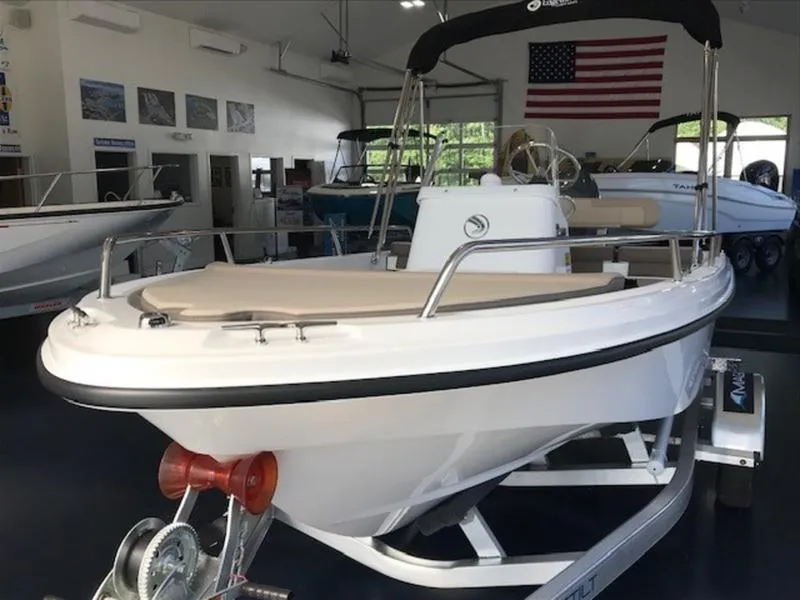 Slide: The Image of 2025 Edgewater 158 CS boat on display in showroom. - 5
