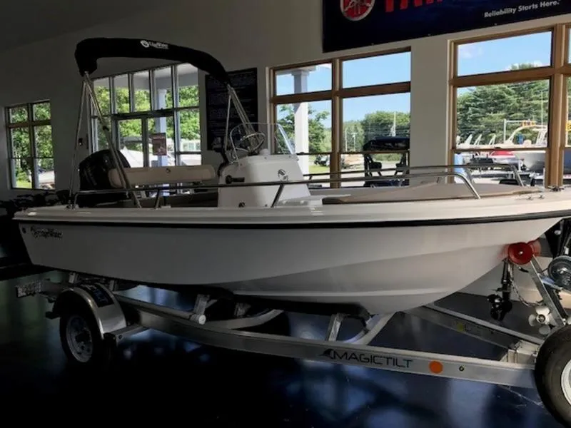 Slide: The Image of 2025 Edgewater 158 CS boat on a Magic Tilt trailer in a showroom. - 6