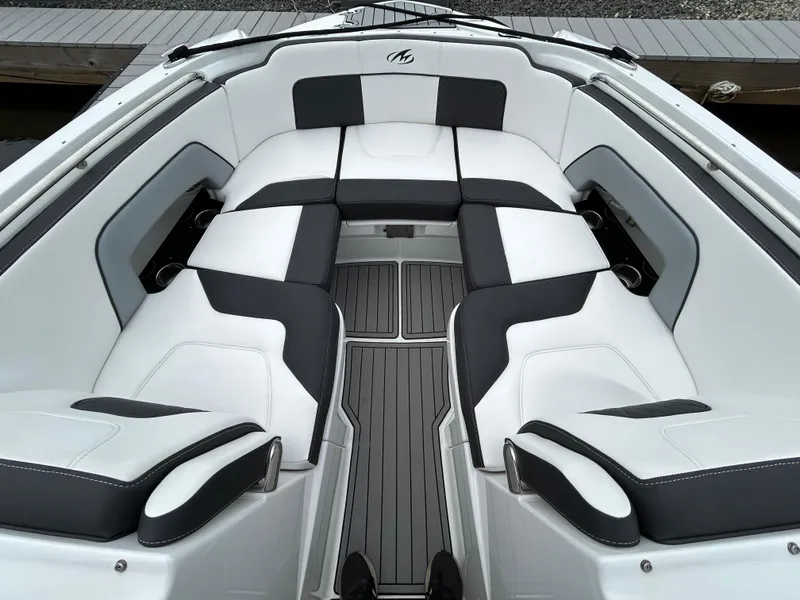 Slide: The Image of 2021 Monterey M65 boat with luxurious white and black seating. - 20