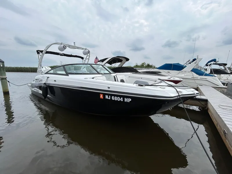 Slide: The Image of 2021 Monterey M65 boat with Mercury engine on trailer under cloudy sky. - 5
