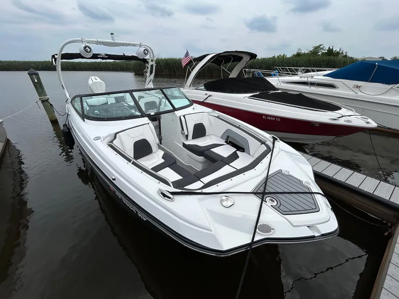 Slide: The Image of 2021 Monterey M65 boat on trailer under cloudy sky. - 6