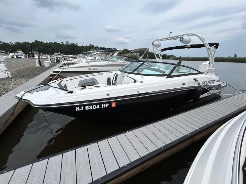 Slide: The Image of 2021 Monterey M65 boat docked at marina with other boats. - 7