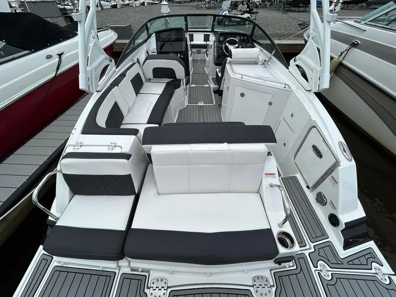 Slide: The Image of 2021 Monterey M65 boat with spacious seating and modern interior design. - 9