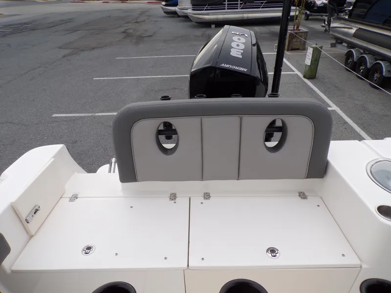 Slide: The Image of 2024 Sea Born LX24 Center Console LE boat stern with seating and storage compartments. - 13