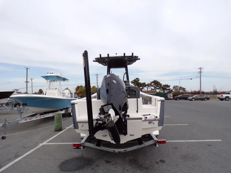 Slide: The Image of 2024 Sea Born LX24 Center Console LE boat, rear view in parking lot. - 14