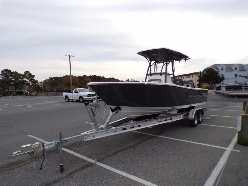 Slide: The Image of 2024 Sea Born LX24 Center Console LE boat on a trailer in a parking lot. - 3