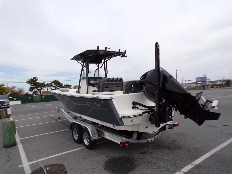 Slide: The Image of 2024 Sea Born LX24 Center Console LE boat on a trailer in a parking lot. - 4