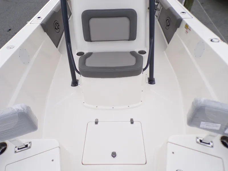 Slide: The Image of 2024 Sea Born LX24 Center Console LE boat interior with seating and storage. - 7