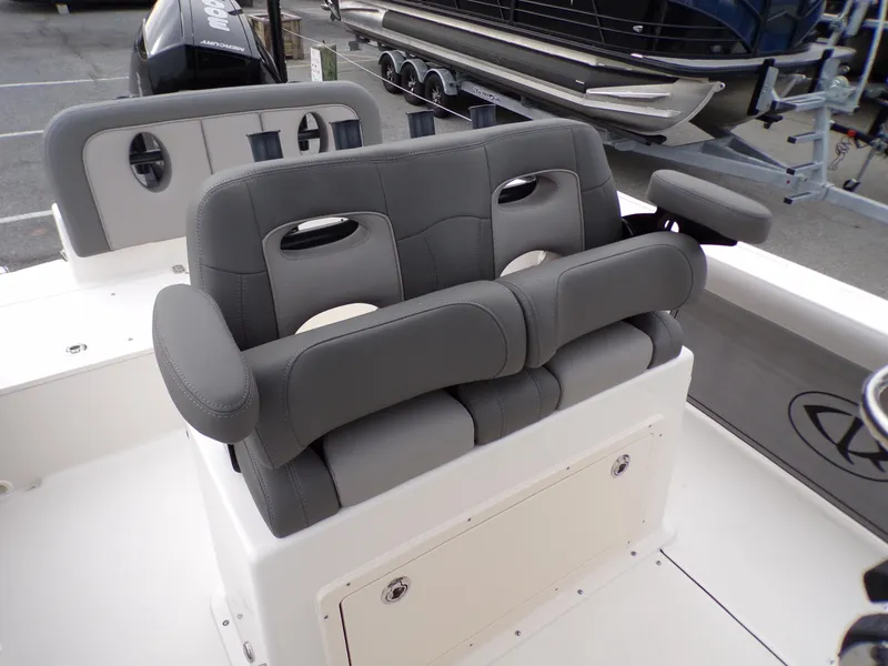 Slide: The Image of 2024 Sea Born LX24 Center Console LE boat with cushioned seating and storage. - 8