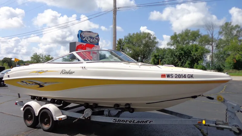 Slide: The Image of 2002 Rinker 212 Captiva Bowrider on ShoreLand'r trailer, parked outdoors. - 3