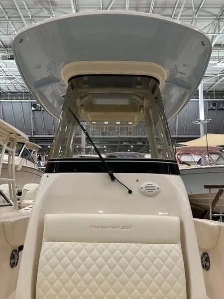 Slide: The Image of 2025 Grady-White Fisherman 257 boat with T-top and windshield in a showroom. - 12