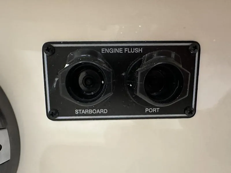 Slide: The Image of Engine flush ports on 2025 Grady-White Fisherman 257 boat, labeled starboard and port. - 17