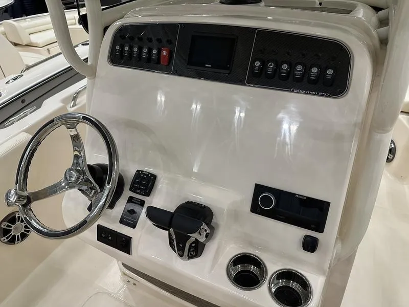 Slide: The Image of 2025 Grady-White Fisherman 257 console with steering wheel and control panel. - 18