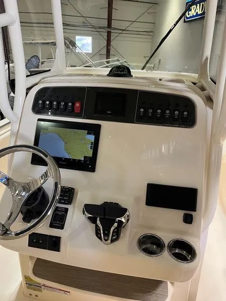 Slide: The Image of 2025 Grady-White Fisherman 257 boat dashboard with navigation and control systems. - 19