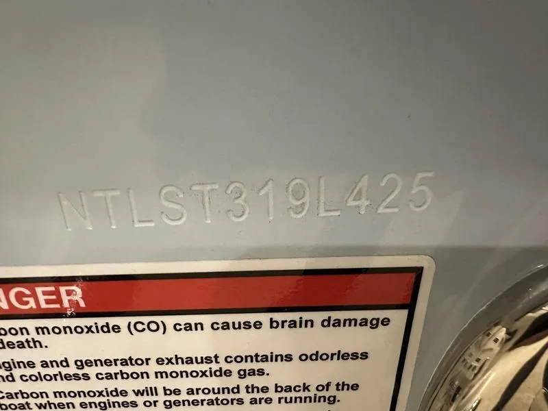 Slide: The Image of 2025 Grady-White Fisherman 257 hull identification number and carbon monoxide warning label. - 3