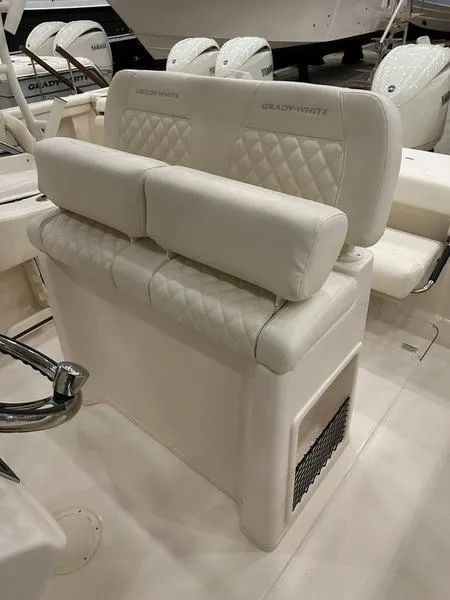 Slide: The Image of 2025 Grady-White Fisherman 257 boat seating with quilted upholstery and storage compartment. - 7