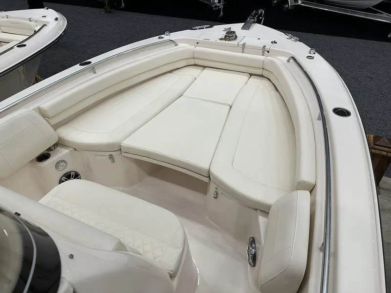 Slide: The Image of 2025 Grady-White Fisherman 257 boat interior with white cushioned seating. - 9