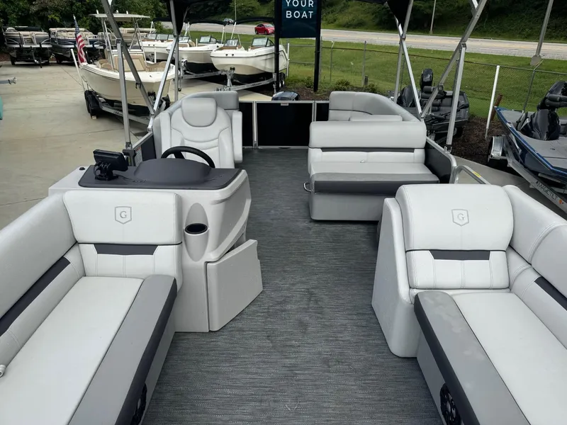 Slide: The Image of 2023 Godfrey 2286 pontoon boat with spacious seating and modern design. - 12