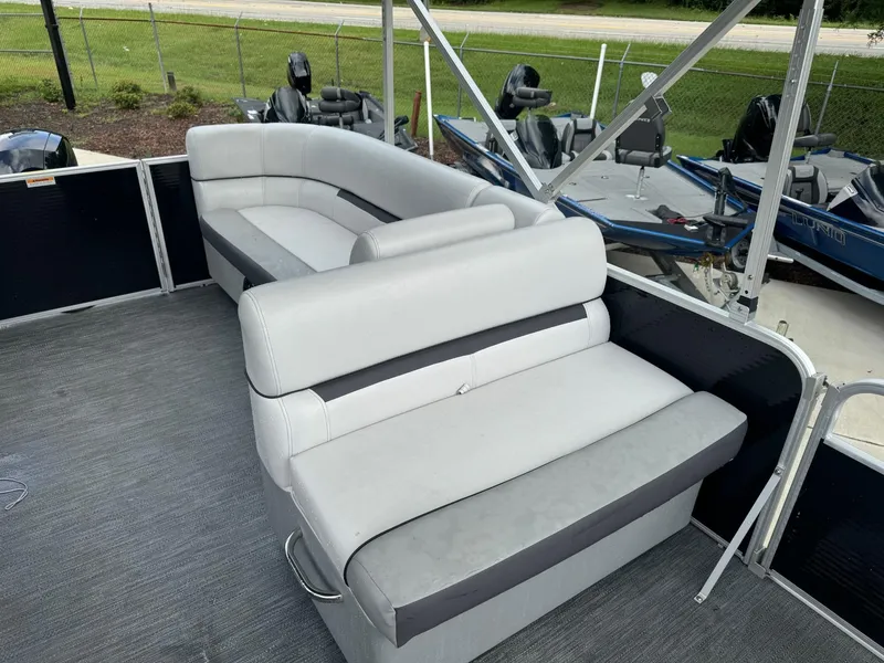 Slide: The Image of 2023 Godfrey 2286 boat interior with gray seating and deck. - 13
