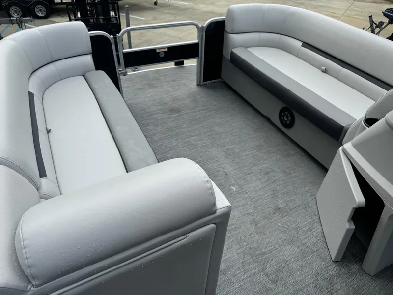Slide: The Image of 2023 Godfrey 2286 boat interior with gray seating and carpeted floor. - 14