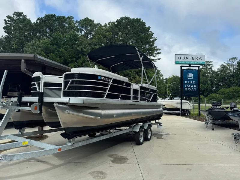 Slide: The Image of 2023 Godfrey 2286 pontoon boat on a trailer at Boateka dealership. - 3