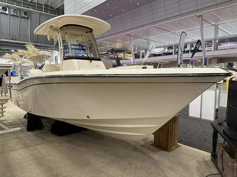 Slide: The Image of 2025 Grady-White Fisherman 236 boat displayed at an indoor exhibition. - 1