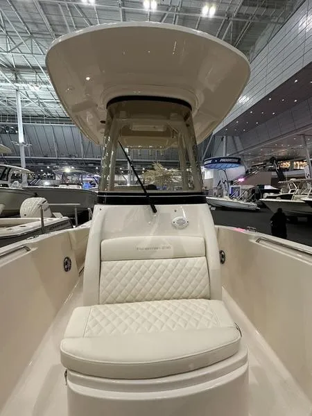 Slide: The Image of 2025 Grady-White Fisherman 236 boat interior with cushioned seating and modern design. - 15