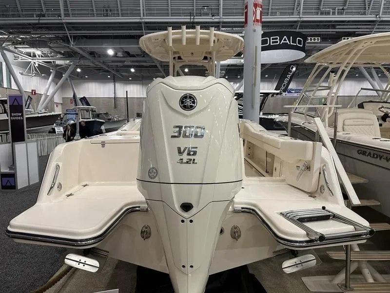 Slide: The Image of 2025 Grady-White Fisherman 236 boat with Yamaha 300 V6 engine displayed at a boat show. - 4